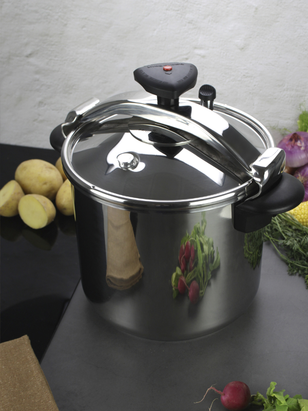 Magefesa Star fast pressure cooker in the table with potatoes and onions
